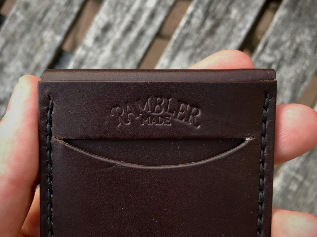 The Scout Wallet, Dark Brown, in Hand Rambler Made Logo Closeup