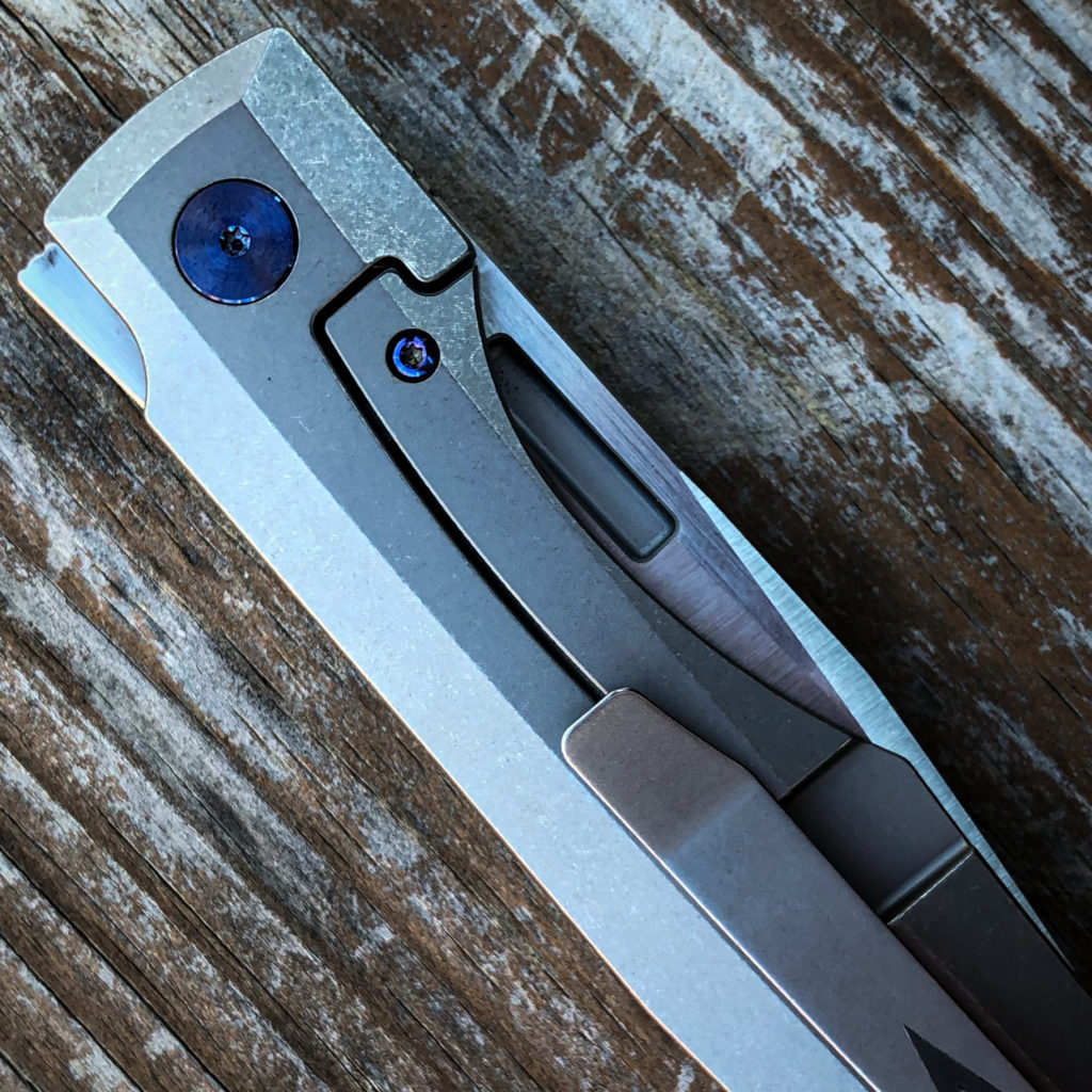 Vero Engineering Impulse knife closed on table showing slim flipper