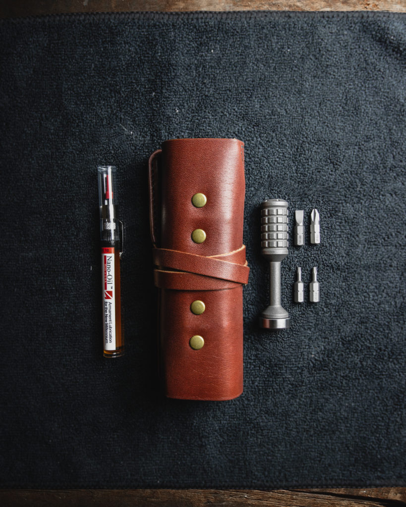 Leather tool roll with titanium bit driver